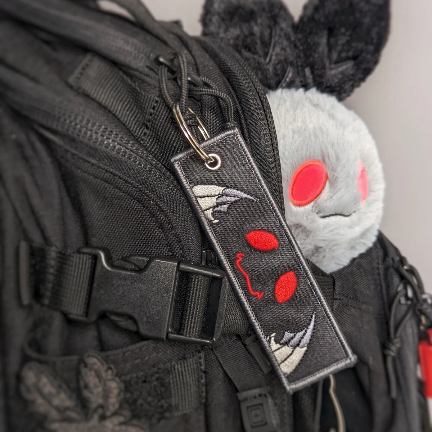 Mothboi jet tag keychain