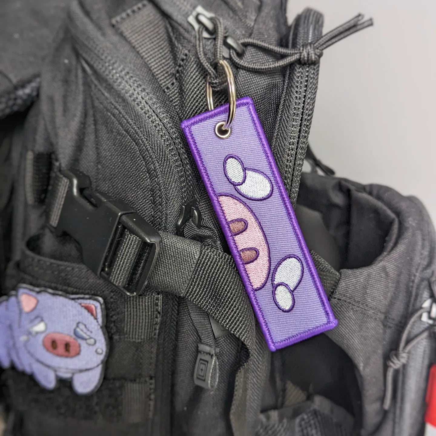 Squonk jet tag keychain