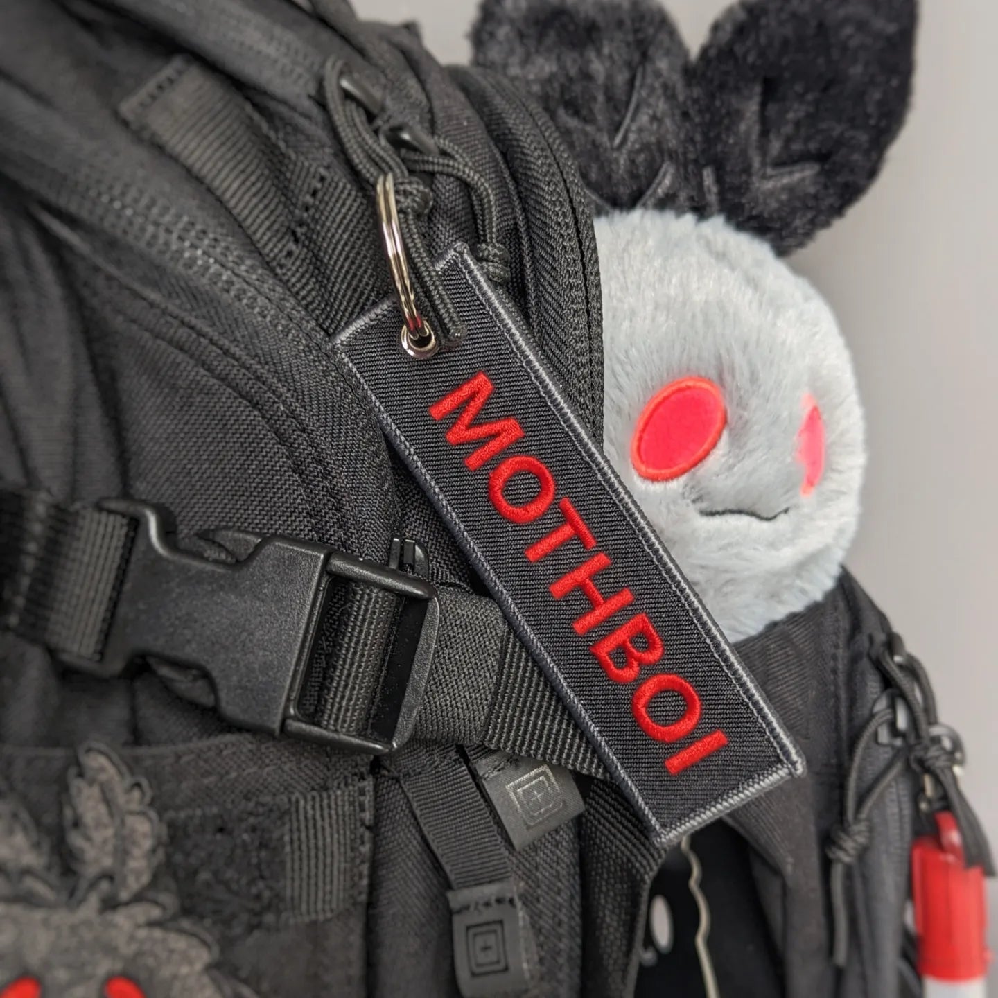 Mothboi jet tag keychain